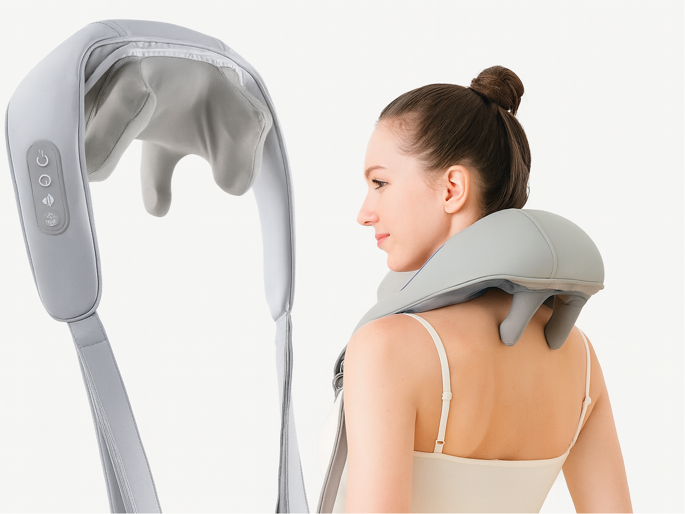 Woman using a neck and shoulder massager on a white background
